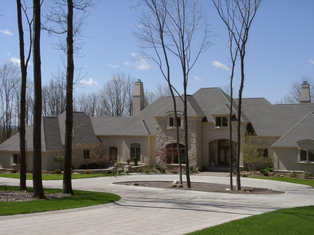 Exterior view of large residential structure with wrapping driveway